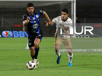 Rodrigo Lopez #7 of Pumas de la UNAM and Alan Medina #11 of Queretaro fight for the ball during the match corresponding to round 16 of the A...