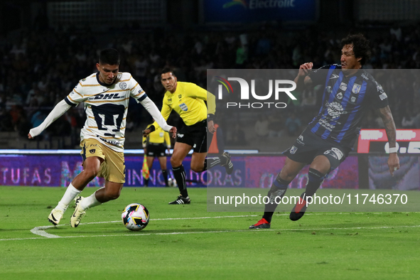 Piero Quispe #27 of Pumas de la UNAM and Jose Canale #6 of Queretaro fight for the ball during the match corresponding to round 16 of the Ap...