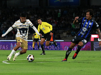 Piero Quispe #27 of Pumas de la UNAM and Jose Canale #6 of Queretaro fight for the ball during the match corresponding to round 16 of the Ap...