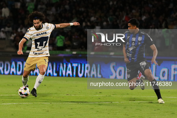 Cesar Huerta #12 of Pumas de la UNAM and Oscar Manzanares #3 of Queretaro fight for the ball during the match corresponding to round 16 of t...