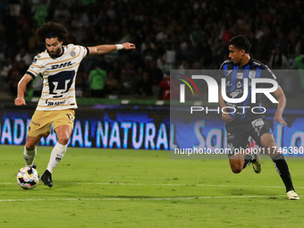 Cesar Huerta #12 of Pumas de la UNAM and Oscar Manzanares #3 of Queretaro fight for the ball during the match corresponding to round 16 of t...