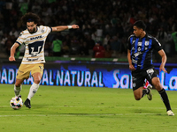 Cesar Huerta #12 of Pumas de la UNAM and Oscar Manzanares #3 of Queretaro fight for the ball during the match corresponding to round 16 of t...