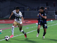 Jorge Ruvalcaba #17 of Pumas de la UNAM and Alan Medina #11 of Queretaro fight for the ball during the match corresponding to round 16 of th...