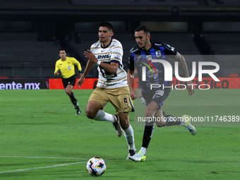 Guillermo Martinez #9 of Pumas de la UNAM and Franco Russo #4 of Queretaro fight for the ball during the match corresponding to round 16 of...