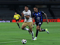 Guillermo Martinez #9 of Pumas de la UNAM and Franco Russo #4 of Queretaro fight for the ball during the match corresponding to round 16 of...