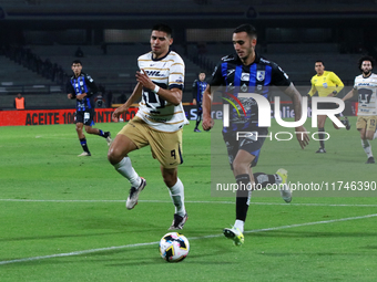 Guillermo Martinez #9 of Pumas de la UNAM and Franco Russo #4 of Queretaro fight for the ball during the match corresponding to round 16 of...