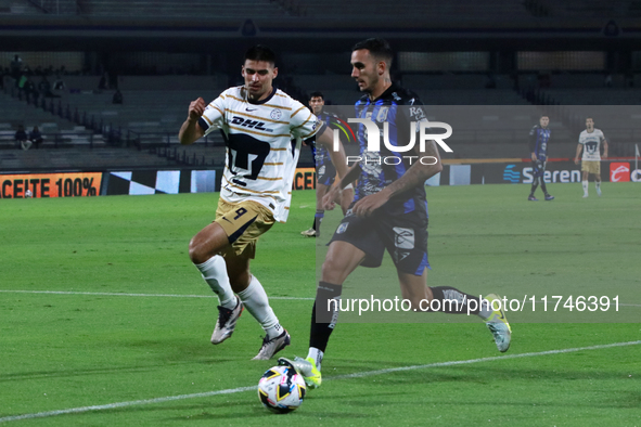 Guillermo Martinez #9 of Pumas de la UNAM and Franco Russo #4 of Queretaro fight for the ball during the match corresponding to round 16 of...