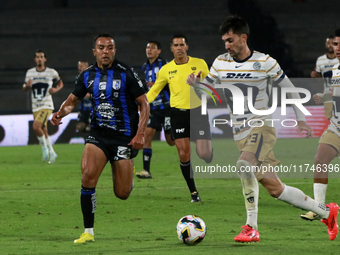 Ignacio Pussetto #23 of Pumas de la UNAM and Omar Mendoza #2 of Queretaro fight for the ball during the match corresponding to round 16 of t...