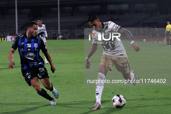 Robert Ergas #22 of Pumas de la UNAM and Juan Robles #187 of Queretaro fight for the ball during the match corresponding to round 16 of the...