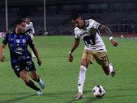 Robert Ergas #22 of Pumas de la UNAM and Juan Robles #187 of Queretaro fight for the ball during the match corresponding to round 16 of the...