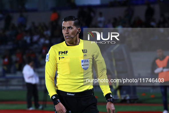 Referee Daniel Quintero Huitron officiates the match corresponding to round 16 of the Apertura 2024 tournament of the Liga BBVA MX, between...