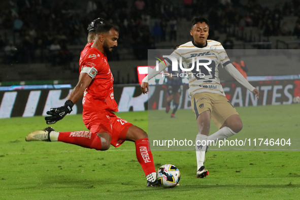 Goalkeeper Guillermo Allison #25 of Queretaro and Angel Rico #189 of Pumas de la UNAM fight for the ball during the match corresponding to r...