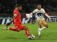 Goalkeeper Guillermo Allison #25 of Queretaro and Angel Rico #189 of Pumas de la UNAM fight for the ball during the match corresponding to r...