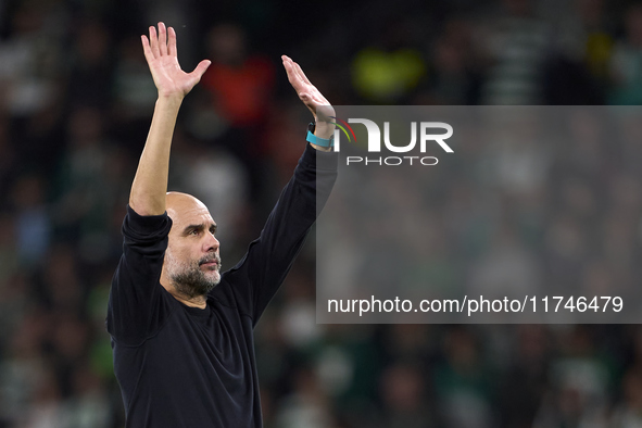 Pep Guardiola, Head Coach of Manchester City, shows appreciation to the fans after the UEFA Champions League match between Sporting CP and M...