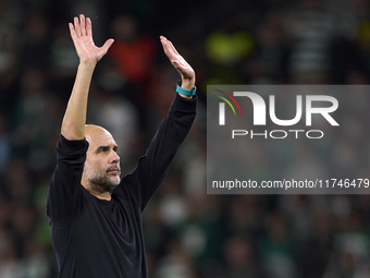 Pep Guardiola, Head Coach of Manchester City, shows appreciation to the fans after the UEFA Champions League match between Sporting CP and M...