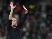 Pep Guardiola, Head Coach of Manchester City, shows appreciation to the fans after the UEFA Champions League match between Sporting CP and M...