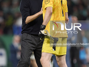 Pep Guardiola, Head Coach of Manchester City, greets Franco Israel of Sporting CP after the UEFA Champions League match between Sporting CP...