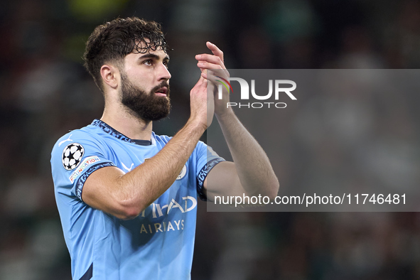 Josko Gvardiol of Manchester City shows appreciation to the fans after the UEFA Champions League match between Sporting CP and Manchester Ci...