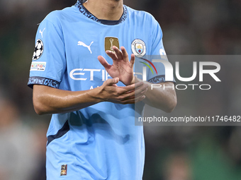 Rico Lewis of Manchester City shows appreciation to the fans after the UEFA Champions League match between Sporting CP and Manchester City a...