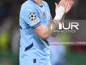 Phil Foden of Manchester City shows appreciation to the fans after the UEFA Champions League match between Sporting CP and Manchester City a...