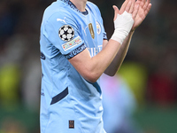 Phil Foden of Manchester City shows appreciation to the fans after the UEFA Champions League match between Sporting CP and Manchester City a...