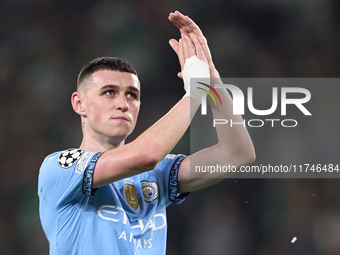 Phil Foden of Manchester City shows appreciation to the fans after the UEFA Champions League match between Sporting CP and Manchester City a...