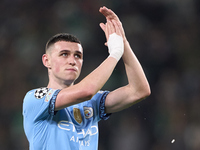 Phil Foden of Manchester City shows appreciation to the fans after the UEFA Champions League match between Sporting CP and Manchester City a...