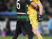 Zeno Debast of Sporting CP and Franco Israel of Sporting CP celebrate victory after the UEFA Champions League match between Sporting CP and...