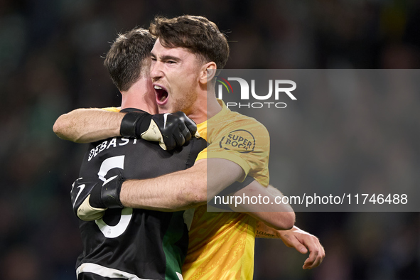 Zeno Debast of Sporting CP and Franco Israel of Sporting CP celebrate victory after the UEFA Champions League match between Sporting CP and...