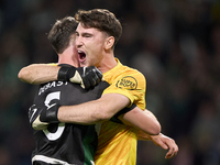 Zeno Debast of Sporting CP and Franco Israel of Sporting CP celebrate victory after the UEFA Champions League match between Sporting CP and...