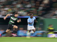 Jeremy Doku of Manchester City is challenged by Eduardo Quaresma of Sporting CP during the UEFA Champions League match between Sporting CP a...