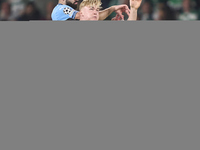 Josko Gvardiol of Manchester City competes for the ball with Conrad Harder of Sporting CP during the UEFA Champions League match between Spo...