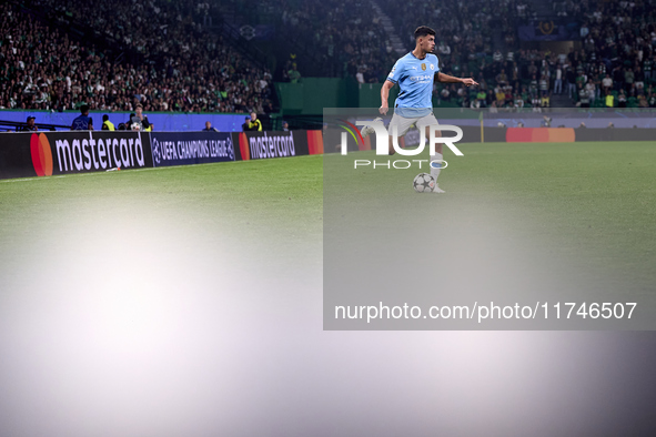 Matheus Nunes of Manchester City is in action during the UEFA Champions League match between Sporting CP and Manchester City at Jose Alvalad...