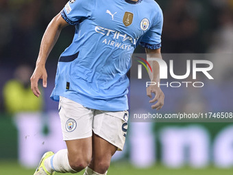 Rico Lewis of Manchester City plays during the UEFA Champions League match between Sporting CP and Manchester City at Jose Alvalade Stadium...