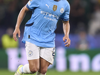 Rico Lewis of Manchester City plays during the UEFA Champions League match between Sporting CP and Manchester City at Jose Alvalade Stadium...