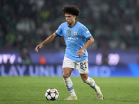 Rico Lewis of Manchester City plays during the UEFA Champions League match between Sporting CP and Manchester City at Jose Alvalade Stadium...