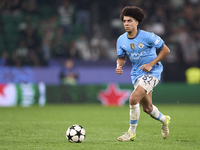 Rico Lewis of Manchester City plays during the UEFA Champions League match between Sporting CP and Manchester City at Jose Alvalade Stadium...