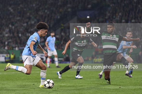 Rico Lewis of Manchester City is challenged by Matheus Reis of Sporting CP during the UEFA Champions League match between Sporting CP and Ma...