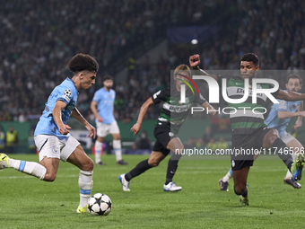 Rico Lewis of Manchester City is challenged by Matheus Reis of Sporting CP during the UEFA Champions League match between Sporting CP and Ma...