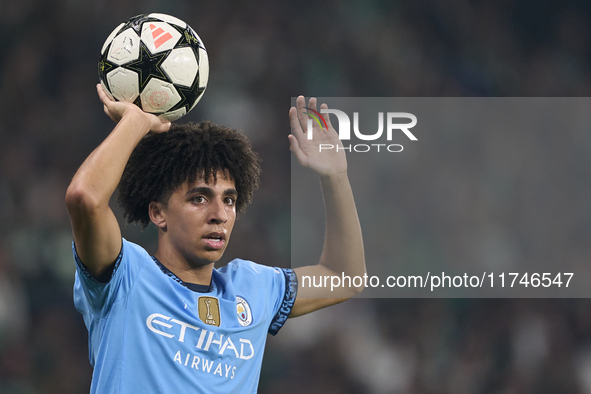 Rico Lewis of Manchester City takes a throw-in during the UEFA Champions League match between Sporting CP and Manchester City at Jose Alvala...