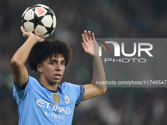 Rico Lewis of Manchester City takes a throw-in during the UEFA Champions League match between Sporting CP and Manchester City at Jose Alvala...