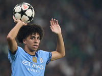 Rico Lewis of Manchester City takes a throw-in during the UEFA Champions League match between Sporting CP and Manchester City at Jose Alvala...