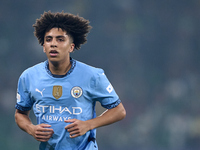 Rico Lewis of Manchester City looks on during the UEFA Champions League match between Sporting CP and Manchester City at Jose Alvalade Stadi...