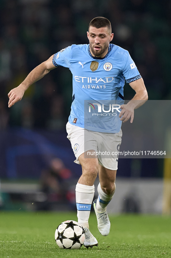 Mateo Kovacic of Manchester City is in action during the UEFA Champions League match between Sporting CP and Manchester City at Jose Alvalad...