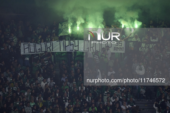 Sporting CP fans light flares in the stand during the UEFA Champions League match between Sporting CP and Manchester City at Jose Alvalade S...