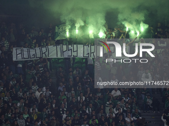 Sporting CP fans light flares in the stand during the UEFA Champions League match between Sporting CP and Manchester City at Jose Alvalade S...