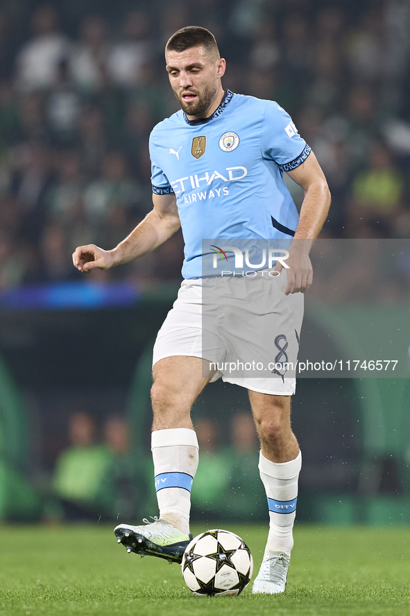 Mateo Kovacic of Manchester City is in action during the UEFA Champions League match between Sporting CP and Manchester City at Jose Alvalad...