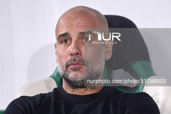 Pep Guardiola, Head Coach of Manchester City, looks on prior to the UEFA Champions League match between Sporting CP and Manchester City at J...