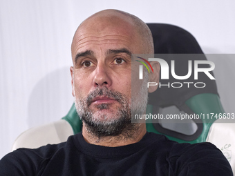 Pep Guardiola, Head Coach of Manchester City, looks on prior to the UEFA Champions League match between Sporting CP and Manchester City at J...