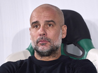 Pep Guardiola, Head Coach of Manchester City, looks on prior to the UEFA Champions League match between Sporting CP and Manchester City at J...